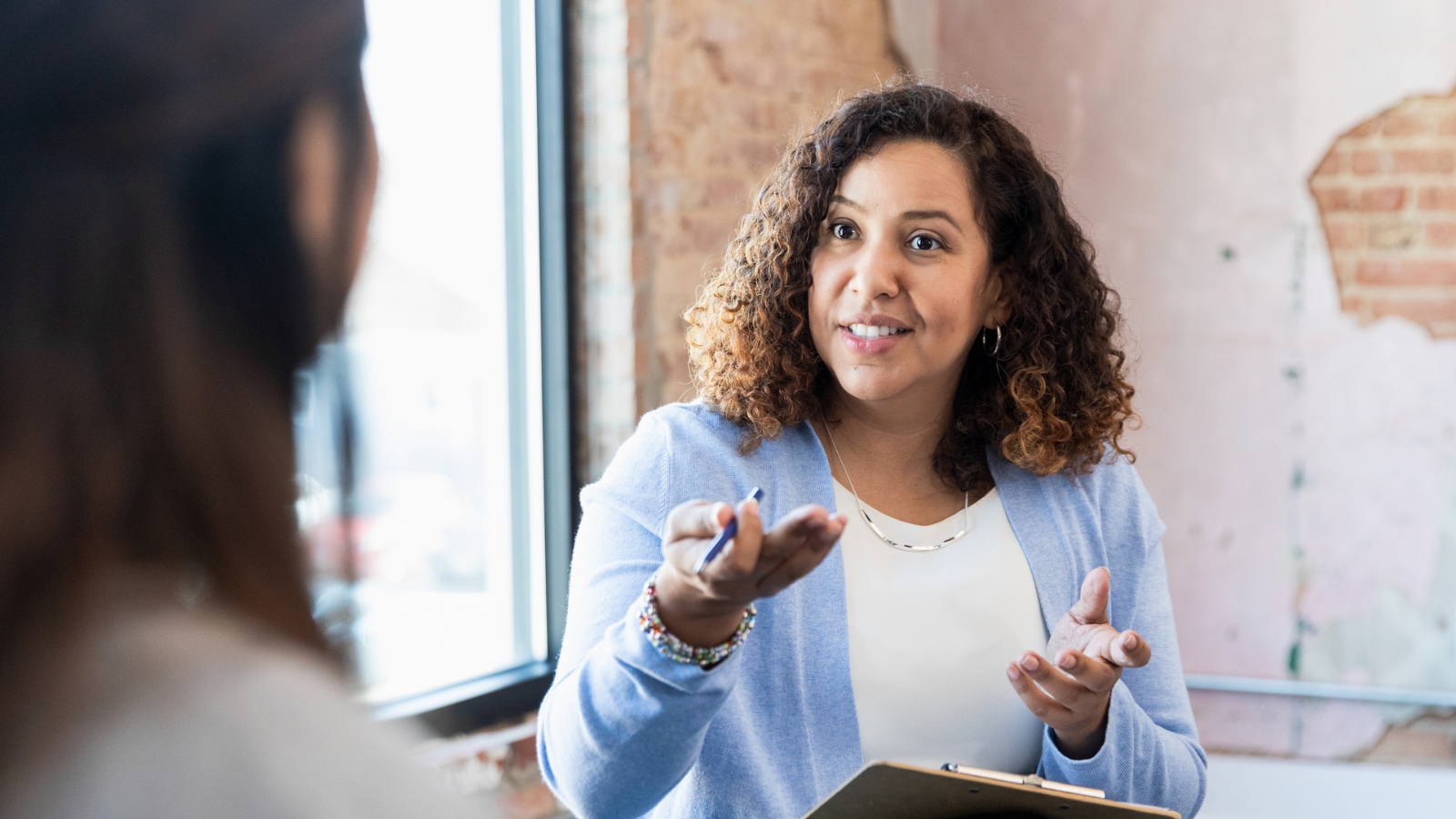 strong female leader female leader speaking to employees