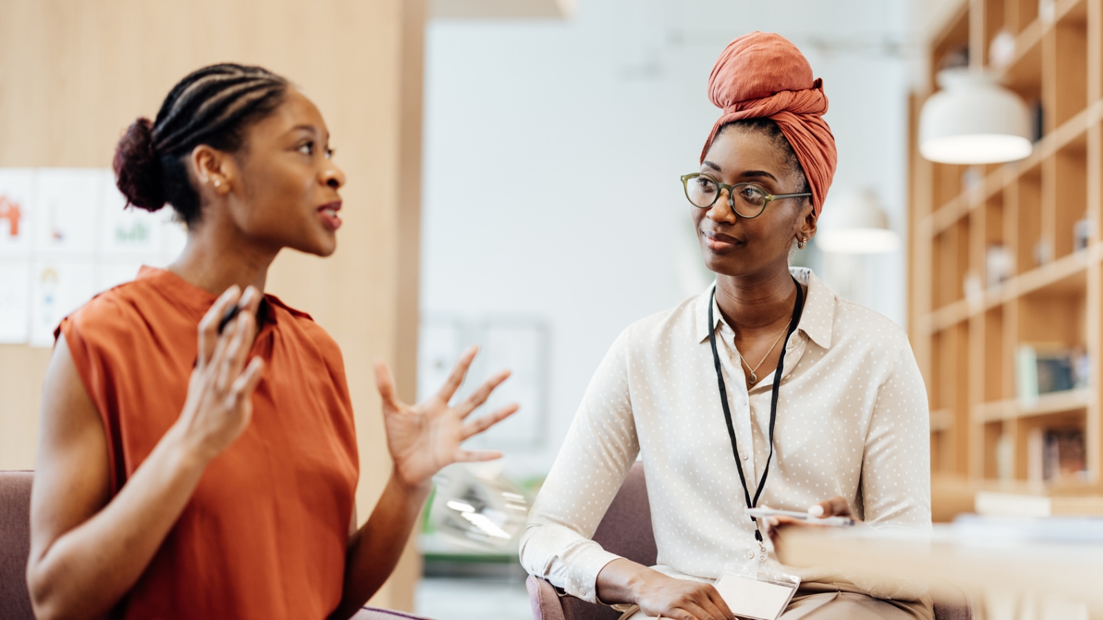 time management two business women talking at work