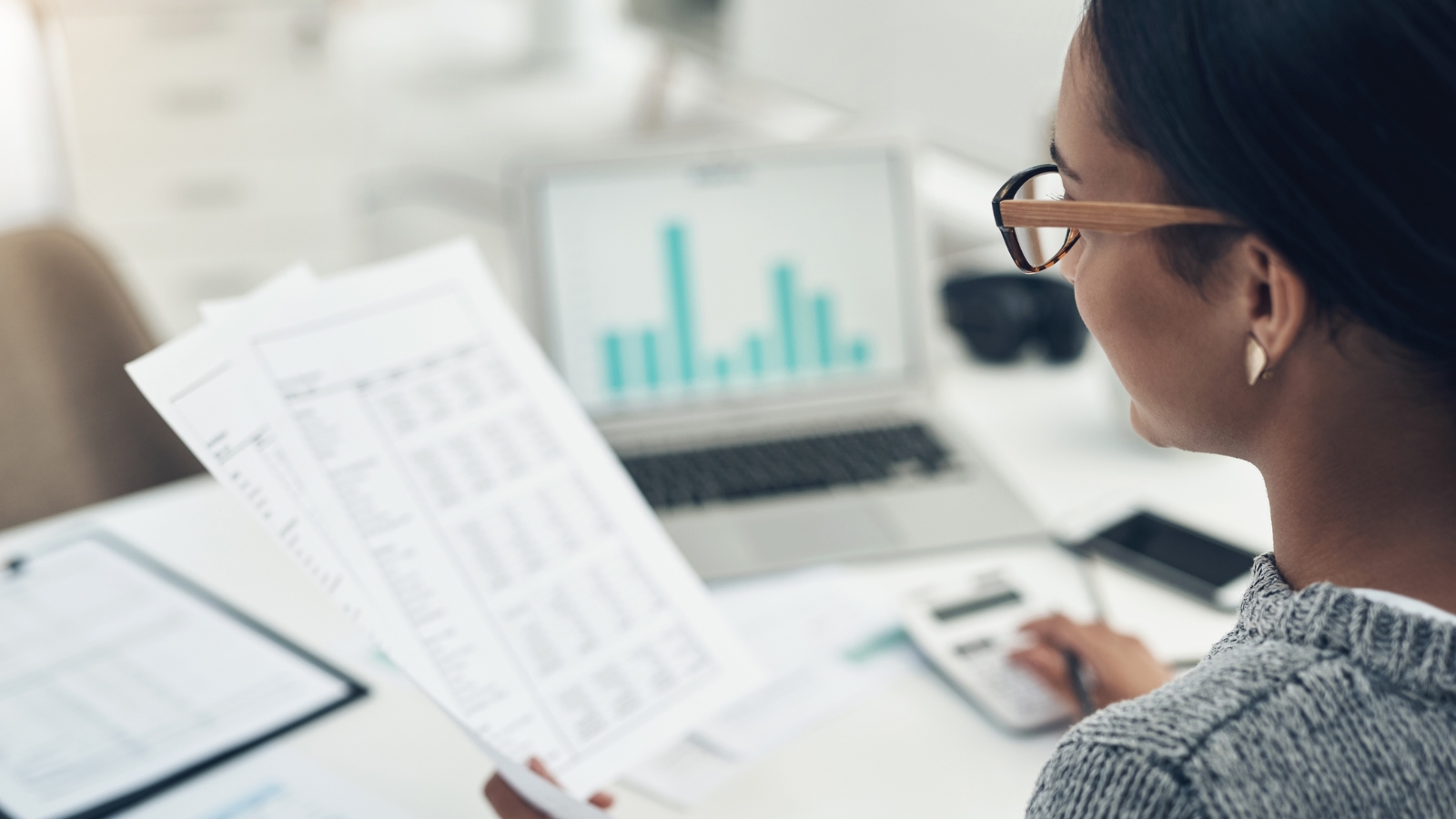 financial literacy businesswoman reviewing financial documents